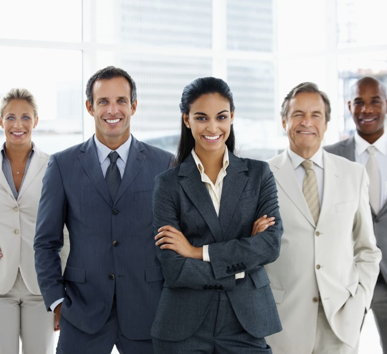 A team of colleagues standing together in an office